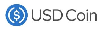 Logo von USD Coin (USDC) mit weißem Dollarzeichen im blauen Kreis und grauem Schriftzug.